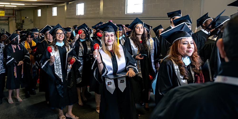 Graduates Posing with Maracas