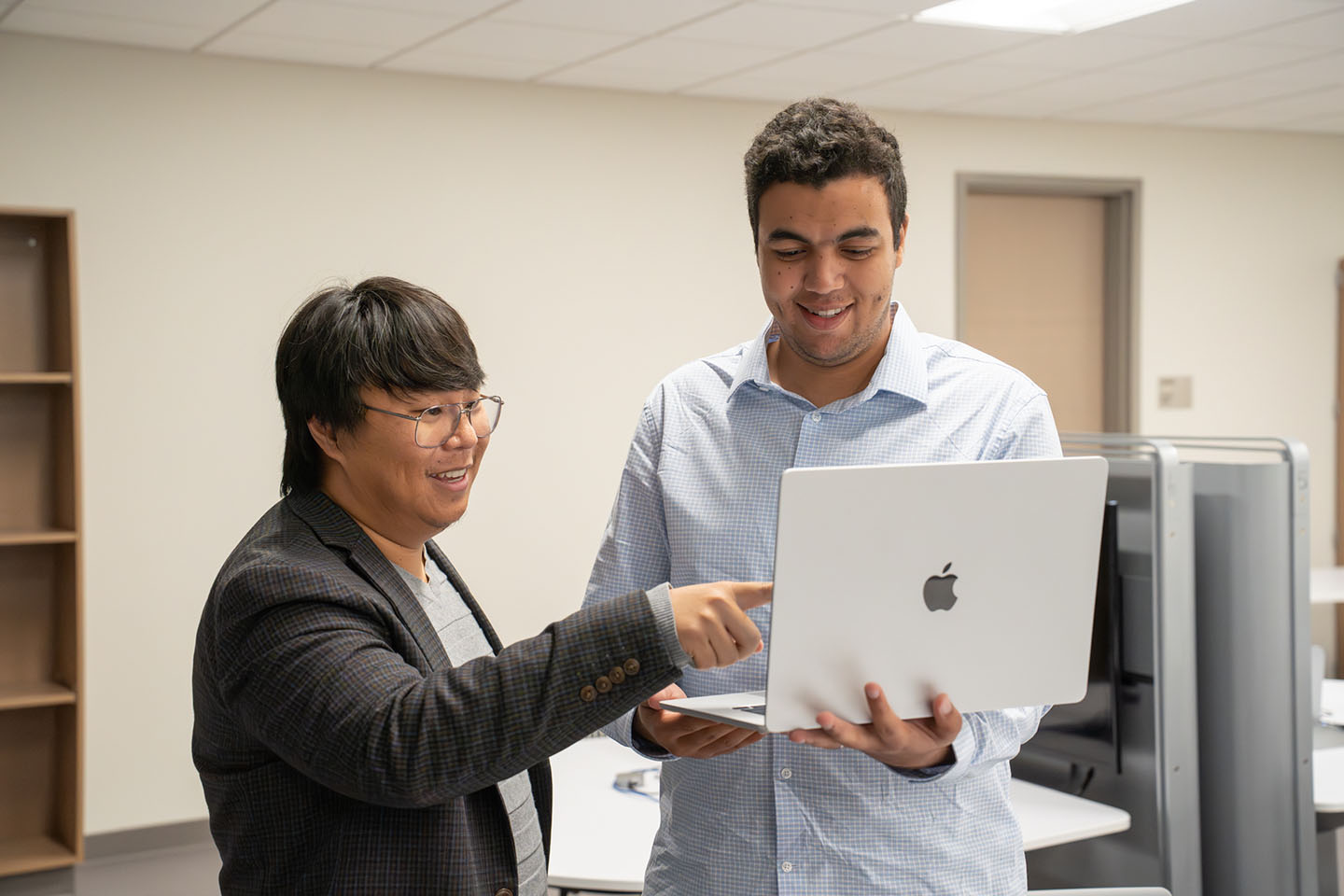Men Looking at Laptop