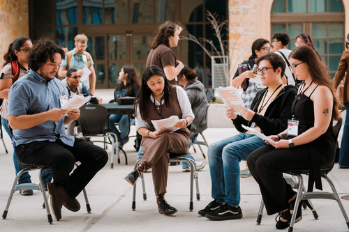 Students-reading-performing-outside