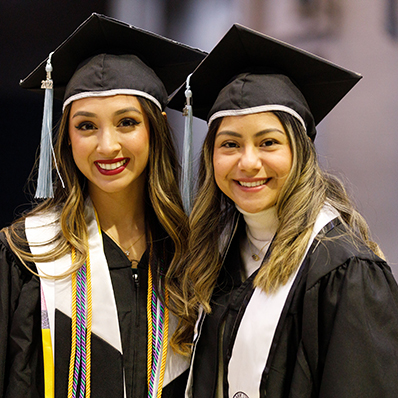 Two Graduate Students Smiling