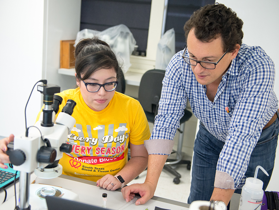 Student and Professor with Microscope