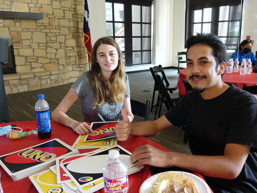 A student playing Uno