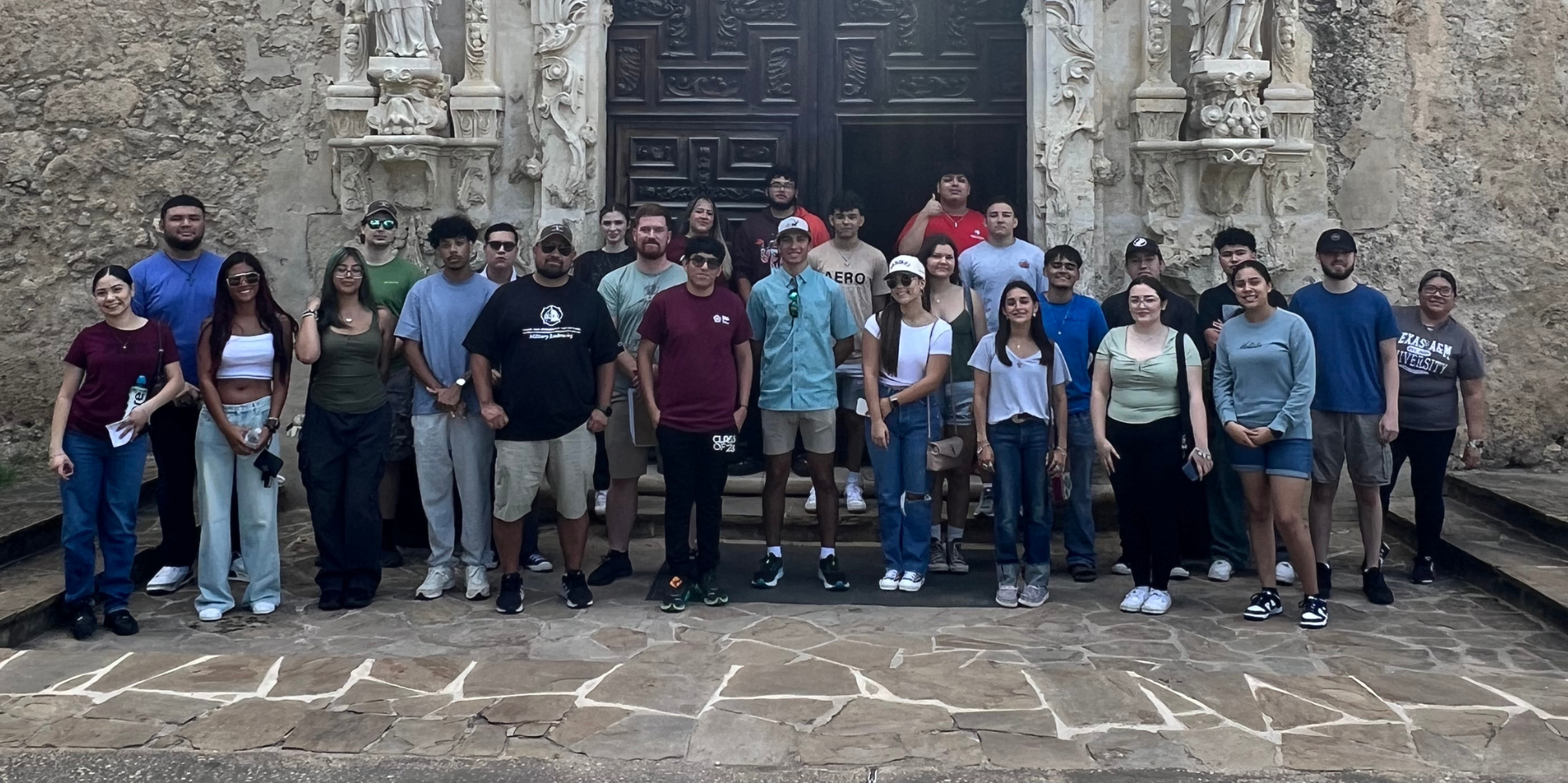 Students in front of old architecture